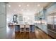 Open concept kitchen with large island, stainless steel appliances, and custom cabinetry at 2760 Sugarloaf Club Dr, Duluth, GA 30097