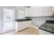 Bright laundry room features lots of cabinets, granite countertop, sink, and convenient access to the outdoors at 2760 Sugarloaf Club Dr, Duluth, GA 30097