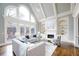 Spacious living room with soaring ceilings, fireplace, built-ins, and plenty of natural light at 2760 Sugarloaf Club Dr, Duluth, GA 30097