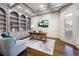 Stylish home office featuring custom built-ins, coffered ceilings and a beautiful hardwood floor at 2760 Sugarloaf Club Dr, Duluth, GA 30097