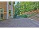 Wooden back deck with outdoor seating and a lush, green backyard at 3875 Sweetwater Dr, Cumming, GA 30041