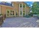 Spacious back deck perfect for outdoor entertaining with string lights and shaded seating area at 3875 Sweetwater Dr, Cumming, GA 30041