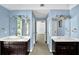 Bathroom with double sink vanity and blue walls at 3875 Sweetwater Dr, Cumming, GA 30041
