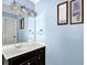 Bathroom features single sink vanity and mirror at 3875 Sweetwater Dr, Cumming, GA 30041