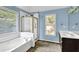 Bathroom featuring a separate tub and shower at 3875 Sweetwater Dr, Cumming, GA 30041