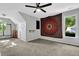Bright bedroom featuring a ceiling fan, window views, and ample space at 3875 Sweetwater Dr, Cumming, GA 30041