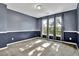 Comfortable bedroom with neutral carpet, three windows, and modern trim at 3875 Sweetwater Dr, Cumming, GA 30041