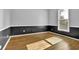 Spacious bedroom with hardwood floors, neutral paint, and large window at 3875 Sweetwater Dr, Cumming, GA 30041