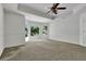 Brightly lit bedroom with tray ceiling and large bright windows at 3875 Sweetwater Dr, Cumming, GA 30041
