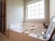 Relaxing bathtub with modern faucets and a shower with glass doors at 803 Plantation Ridge Overlook, Woodstock, GA 30188