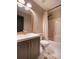 Updated bathroom features a sleek vanity, neutral paint, and shower-tub combo at 803 Plantation Ridge Overlook, Woodstock, GA 30188