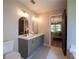 Bathroom with double vanity, modern fixtures, and access to the main bedroom at 803 Plantation Ridge Overlook, Woodstock, GA 30188