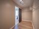 Walk-in closet with wood floors and white wire shelving with access to the main bathroom at 803 Plantation Ridge Overlook, Woodstock, GA 30188