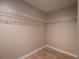 Walk-in closet with wood floors and white wire shelving for ample storage at 803 Plantation Ridge Overlook, Woodstock, GA 30188