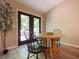 Cozy dining area with a round table, chairs, and a view to the outdoor patio at 803 Plantation Ridge Overlook, Woodstock, GA 30188