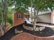 Beautiful home featuring a landscaped yard with stone accents leading to a welcoming front entrance at 803 Plantation Ridge Overlook, Woodstock, GA 30188