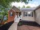 Inviting front entrance with a decorative wreath, sidelights, and a well-maintained yard at 803 Plantation Ridge Overlook, Woodstock, GA 30188
