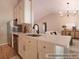 Updated kitchen offers stainless appliances, white cabinets, and quartz counters; refrigerator digitally added at 803 Plantation Ridge Overlook, Woodstock, GA 30188