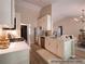 Bright, well-lit kitchen with stainless appliances and a view into the living room at 803 Plantation Ridge Overlook, Woodstock, GA 30188