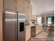 Updated kitchen boasts stainless appliances, white cabinets, and quartz counters; refrigerator digitally added at 803 Plantation Ridge Overlook, Woodstock, GA 30188