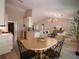 Open-concept home with modern kitchen flowing into the living and dining areas at 803 Plantation Ridge Overlook, Woodstock, GA 30188