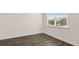 Bedroom with luxury vinyl plank flooring, neutral paint and a large window at 1089 Blue Juniper Cir, Loganville, GA 30052
