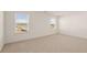 Bedroom with bright windows, neutral carpet, and a closet at 1089 Blue Juniper Cir, Loganville, GA 30052