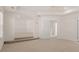 Bonus room with stairs leading to the lower level and view to hall at 1089 Blue Juniper Cir, Loganville, GA 30052