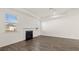Bright living room featuring a cozy fireplace and hardwood floors at 1089 Blue Juniper Cir, Loganville, GA 30052