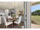 Open floorplan featuring a well-lit dining area connecting to the modern kitchen at 13574 Se Whitman Ln, Covington, GA 30014
