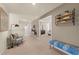 Hallway with decorative furniture, art and a view into other rooms including a bedroom at 13574 Se Whitman Ln, Covington, GA 30014