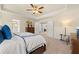 Bright main bedroom with ensuite bathroom and walk-in closet entrances at 13574 Se Whitman Ln, Covington, GA 30014