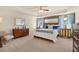 Spacious main bedroom with tray ceiling, ceiling fan, and large windows at 13574 Se Whitman Ln, Covington, GA 30014