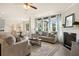 Inviting open floorplan with modern kitchen, dining area, and comfortable living space with fireplace at 13574 Se Whitman Ln, Covington, GA 30014