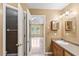 Bathroom featuring a vanity, sink, and entrance to the primary bedroom at 1901 Cherwell Dr, Riverdale, GA 30296