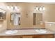 Bathroom featuring double vanity with separate sinks and two large mirrors at 1901 Cherwell Dr, Riverdale, GA 30296