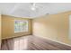 Bedroom with tray ceilings, natural light and wood flooring at 1901 Cherwell Dr, Riverdale, GA 30296