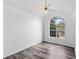 Bedroom features vaulted ceiling, ceiling fan, and a large window at 1901 Cherwell Dr, Riverdale, GA 30296