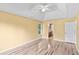 Bedroom featuring tray ceilings, natural light and wood-look flooring at 1901 Cherwell Dr, Riverdale, GA 30296
