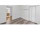 Bedroom featuring closet space, natural light, and wood-look flooring at 1901 Cherwell Dr, Riverdale, GA 30296