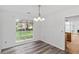Dining area with large window providing ample natural light and views of the outdoor scenery at 1901 Cherwell Dr, Riverdale, GA 30296
