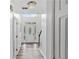 Bright and inviting entryway features a glass-paneled front door, transom window, and hardwood floors at 1901 Cherwell Dr, Riverdale, GA 30296