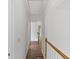 Hallway featuring hardwood floors with access to multiple rooms at 1901 Cherwell Dr, Riverdale, GA 30296