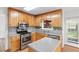 Charming kitchen with stainless appliances, light wood cabinetry and counterspace for food preparation at 1901 Cherwell Dr, Riverdale, GA 30296