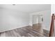 Bright living room with hardwood floors and seamless transition into the dining area, great for entertaining at 1901 Cherwell Dr, Riverdale, GA 30296