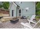 Backyard patio with a fire pit, Adirondack chairs, and a newly built deck at 41 Spring Nw Ln, Atlanta, GA 30314