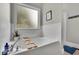 Relaxing white bathroom with a soaking tub and a frosted window at 41 Spring Nw Ln, Atlanta, GA 30314