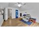 Spacious room with light floors, features a ceiling fan and playful decor for a comfortable living space at 41 Spring Nw Ln, Atlanta, GA 30314