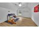 Bright bedroom with ceiling fan, window, and faux wood flooring offers comfortable living space at 41 Spring Nw Ln, Atlanta, GA 30314