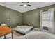 Spacious bedroom with a ceiling fan, light-filled window, and light carpet at 41 Spring Nw Ln, Atlanta, GA 30314